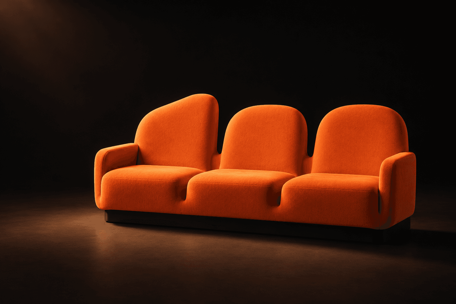 Three connected orange front-row seats in a dark studio